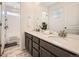 Bathroom featuring double sink vanity, white countertops and tile flooring at 13261 E 110Th Pl, Commerce City, CO 80022