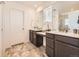 Bathroom featuring double vanity, a large mirror, and modern fixtures at 13261 E 110Th Pl, Commerce City, CO 80022