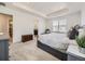 Bright main bedroom with tray ceiling, large window and access to the en-suite bathroom at 13261 E 110Th Pl, Commerce City, CO 80022