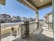 View from the covered front porch showing the street and neighborhood of this charming home at 13261 E 110Th Pl, Commerce City, CO 80022