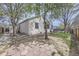 Large backyard with trees, garden beds and privacy fence at 2556 E 131St Pl, Thornton, CO 80241