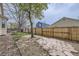 Large backyard with trees, garden beds and privacy fence at 2556 E 131St Pl, Thornton, CO 80241