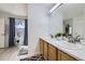 Bathroom with double sinks, a large mirror, and plenty of natural light at 2556 E 131St Pl, Thornton, CO 80241