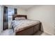 Comfortable bedroom featuring a plush bed, soft carpet, and natural light from the window at 2556 E 131St Pl, Thornton, CO 80241
