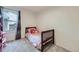 Bright bedroom with twin bed and colorful pillows next to window at 2556 E 131St Pl, Thornton, CO 80241
