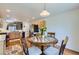 Bright breakfast nook with a view into the kitchen and stainless steel refrigerator at 2556 E 131St Pl, Thornton, CO 80241