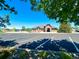 View of the community clubhouse from the parking lot, featuring a playground and picnic pavilion at 2556 E 131St Pl, Thornton, CO 80241