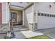 Inviting front porch with seating area and detailed brickwork, leading to a well-maintained home at 2556 E 131St Pl, Thornton, CO 80241
