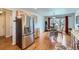 Bright, updated kitchen with stainless steel refrigerator and adjacent breakfast nook featuring a dining table at 2556 E 131St Pl, Thornton, CO 80241