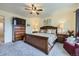 Spacious main bedroom with a ceiling fan and wood furnishings at 2556 E 131St Pl, Thornton, CO 80241