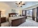 Comfortable main bedroom with bay windows and ceiling fan at 2556 E 131St Pl, Thornton, CO 80241