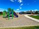A blue and green playground with slides and climbing structures, with the clubhouse in the background at 2556 E 131St Pl, Thornton, CO 80241