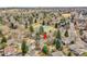 Aerial shot of a home near a park with tennis courts and a pool, showing community amenities at 5050 W 102Nd Ave, Westminster, CO 80031