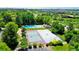 Aerial view showcases the pool, tennis, and basketball courts in a leafy setting at 5050 W 102Nd Ave, Westminster, CO 80031