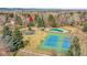 Aerial view of home close to community amenities: pool, tennis courts and common green space at 5050 W 102Nd Ave, Westminster, CO 80031
