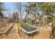 A spacious backyard with a trampoline, garden area, and a unique treehouse at 5050 W 102Nd Ave, Westminster, CO 80031