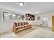 Finished basement offers natural light, carpeted floors, and a built-in bookshelf for storage at 5050 W 102Nd Ave, Westminster, CO 80031