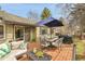 Inviting wooden deck with outdoor furniture, umbrella and grill; perfect for outdoor entertaining at 5050 W 102Nd Ave, Westminster, CO 80031