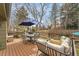 Spacious deck features outdoor dining, lounging furniture, and a shade umbrella at 5050 W 102Nd Ave, Westminster, CO 80031