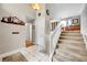 Bright foyer featuring tiled flooring, a staircase, and neutral wall color at 5050 W 102Nd Ave, Westminster, CO 80031