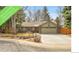 Charming single-story home with a well-maintained lawn, mature trees, and attached garage at 5050 W 102Nd Ave, Westminster, CO 80031