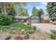 Charming ranch-style home with a well-manicured lawn, mature trees, and a two-car garage at 5050 W 102Nd Ave, Westminster, CO 80031