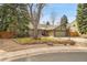 Charming single-Gathering home with a well-manicured lawn, mature trees, and an attached two-car garage at 5050 W 102Nd Ave, Westminster, CO 80031