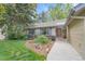 Charming ranch-style home with a well-manicured lawn, mature trees, and a inviting front entrance at 5050 W 102Nd Ave, Westminster, CO 80031