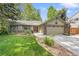 Charming ranch-style home with a well-manicured lawn, mature trees, and a two-car garage at 5050 W 102Nd Ave, Westminster, CO 80031