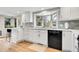 Modern kitchen featuring white cabinets, stainless steel appliances, and a bright window at 5050 W 102Nd Ave, Westminster, CO 80031