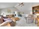 Spacious living room with vaulted ceiling, neutral carpet, and comfortable seating at 5050 W 102Nd Ave, Westminster, CO 80031