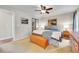 Bedroom featuring ceiling fan, closet with mirrored doors and neutral walls at 5050 W 102Nd Ave, Westminster, CO 80031