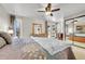 Cozy bedroom featuring ceiling fan, sliding glass door to backyard and closet at 5050 W 102Nd Ave, Westminster, CO 80031