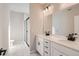 Bathroom features a dual sink vanity with white countertops and a glass enclosed shower at 9629 Browns Peak Cir, Littleton, CO 80125
