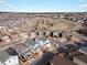 A panoramic view of a neighborhood, highlighting the houses, parks, and streets from above at 11650 Park South Ln, Parker, CO 80138