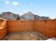 A backyard with a wooden fence and landscaping rocks; a perfect space for outdoor enjoyment at 11650 Park South Ln, Parker, CO 80138