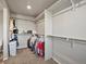 A walk-in closet with shelving and hanging space for ample storage solutions at 11650 Park South Ln, Parker, CO 80138
