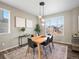 Elegant dining area featuring modern lighting, stylish decor, and large windows at 11650 Park South Ln, Parker, CO 80138