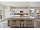 Well-lit kitchen with a large island, modern appliances, and ample counter space for cooking at 11650 Park South Ln, Parker, CO 80138