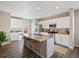 Spacious kitchen with white cabinetry, granite island, stainless steel appliances, and modern design at 11650 Park South Ln, Parker, CO 80138