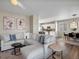 Cozy living room featuring a sectional sofa, modern artwork, and an open layout at 11650 Park South Ln, Parker, CO 80138