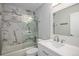 Bathroom featuring a marble tiled shower with sliding glass door and modern vanity at 19334 E Prentice Pl, Centennial, CO 80015