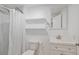 Bathroom with marble tile, modern vanity and shower-tub combination at 19334 E Prentice Pl, Centennial, CO 80015