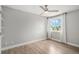 Bright bedroom with natural light, ceiling fan, and light hardwood flooring at 19334 E Prentice Pl, Centennial, CO 80015