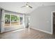Bright bedroom with a view of the backyard through a large window and natural light from other windows at 19334 E Prentice Pl, Centennial, CO 80015