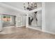 Grand foyer with hardwood floors, modern chandelier, high ceilings and a staircase to the upper level at 19334 E Prentice Pl, Centennial, CO 80015