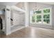 Bright living room with high ceilings, large windows, hardwood floors, and neutral paint at 19334 E Prentice Pl, Centennial, CO 80015