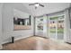 Well-lit room with wood floors, bright windows, and easy access to the backyard at 19334 E Prentice Pl, Centennial, CO 80015