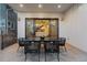 Covered patio with sleek dining set adjacent to glass doors for seamless indoor and outdoor living at 684 S Vine St, Denver, CO 80209