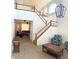 Bright foyer with soaring ceilings, staircase, large windows, and an elegant chandelier at 12578 Dexter Way, Thornton, CO 80241